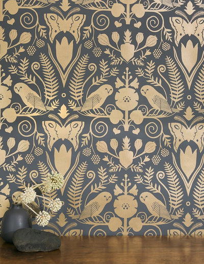 product image for Barn Owls and Hollyhocks Wallpaper in Gold on Charcoal by Carson Ellis for Thatcher Studio 51