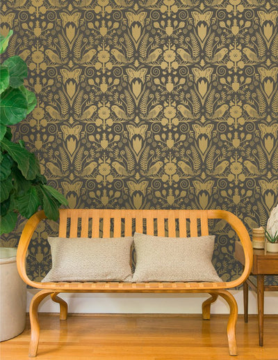 product image for Barn Owls and Hollyhocks Wallpaper in Gold on Charcoal by Carson Ellis for Thatcher Studio 16