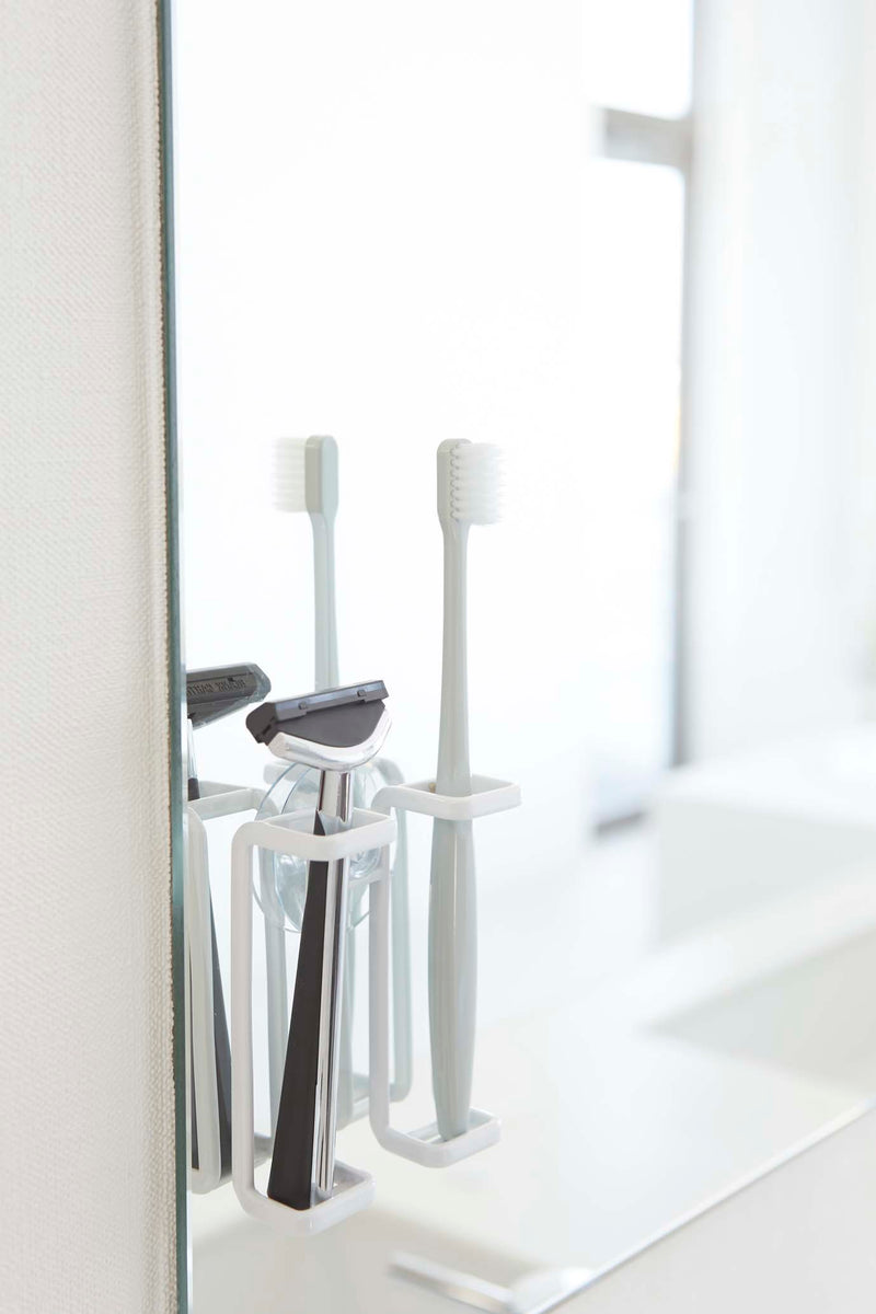 media image for Tower Suction Cup Mounted Toothbrush Holder by Yamazaki 271