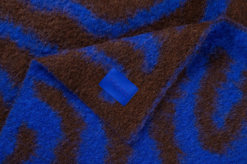 media image for monster ultramarine blue brown wiggle throw by hem 30530 2 210