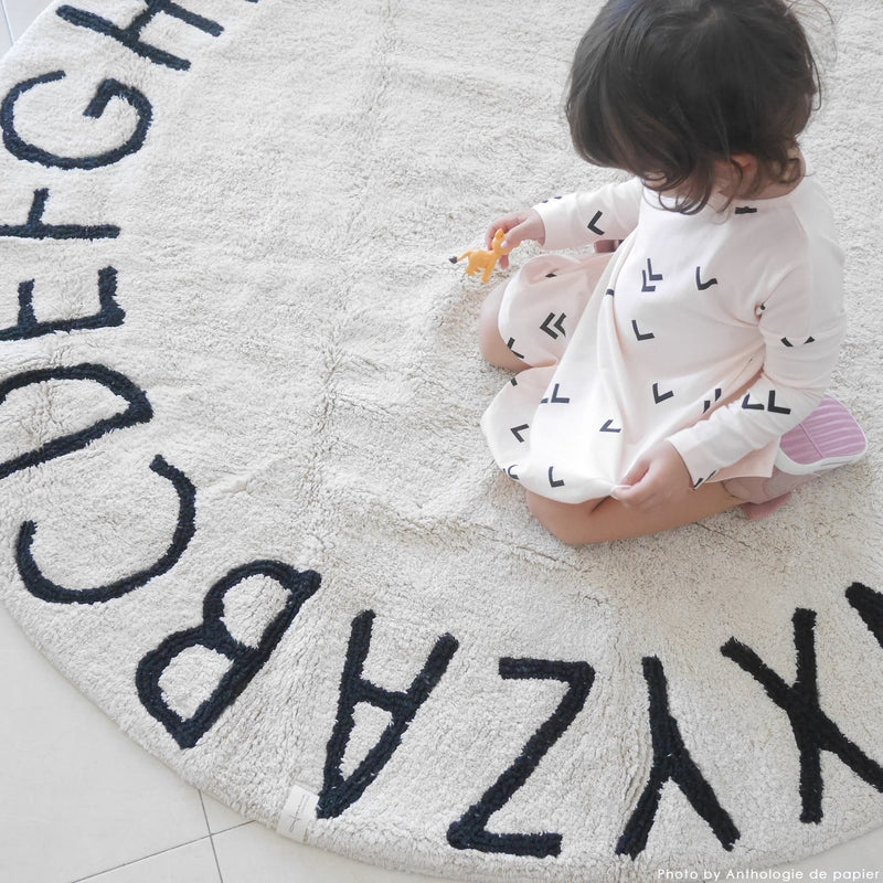 media image for round abc rug in natural black design by lorena canals 10 24