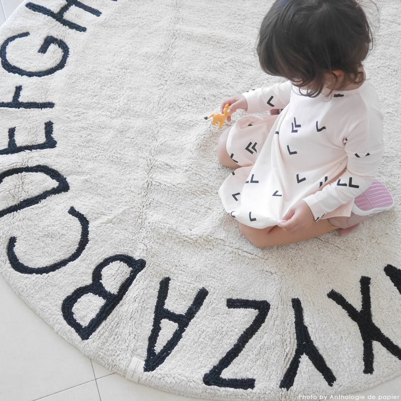 media image for round abc rug in natural black design by lorena canals 10 250