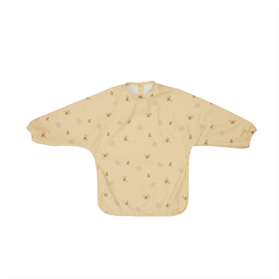 product image of dino cape bib in butter 1 581