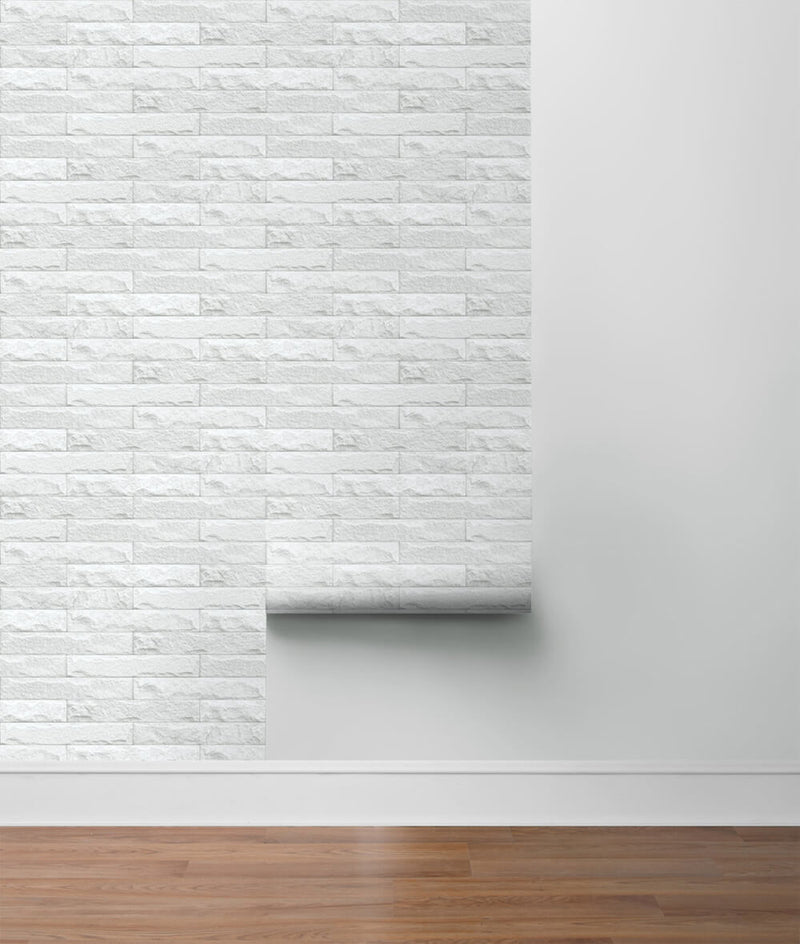 media image for Limestone Brick Peel-and-Stick Wallpaper in Eggshell and Grey by NextWall 224
