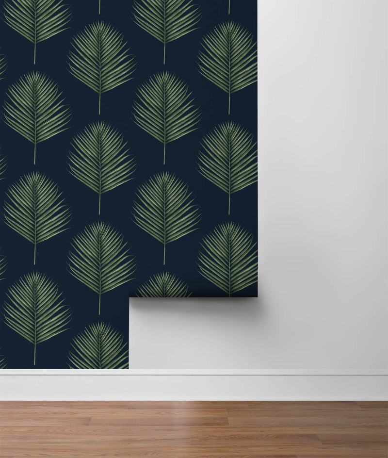 media image for Maui Palm Peel-and-Stick Wallpaper in Midnight Blue and Paradise Green from the Luxe Haven Collection by Lillian August 21