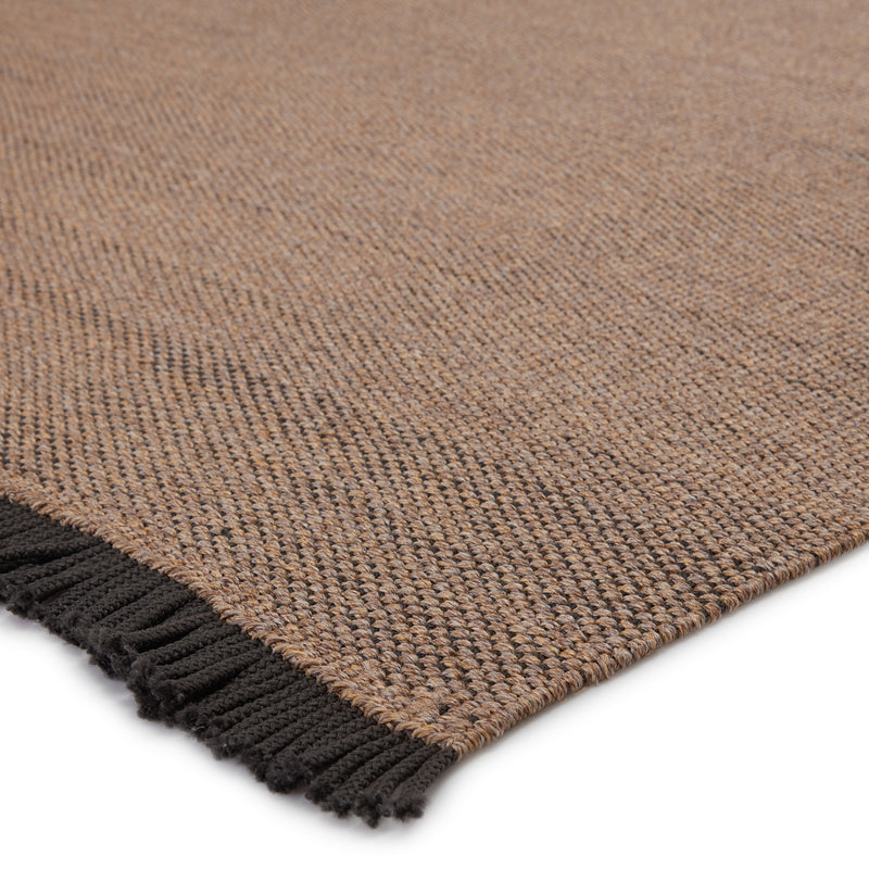 media image for savvy handmade indoor outdoor solid tan black area rug by jaipur living 2 219