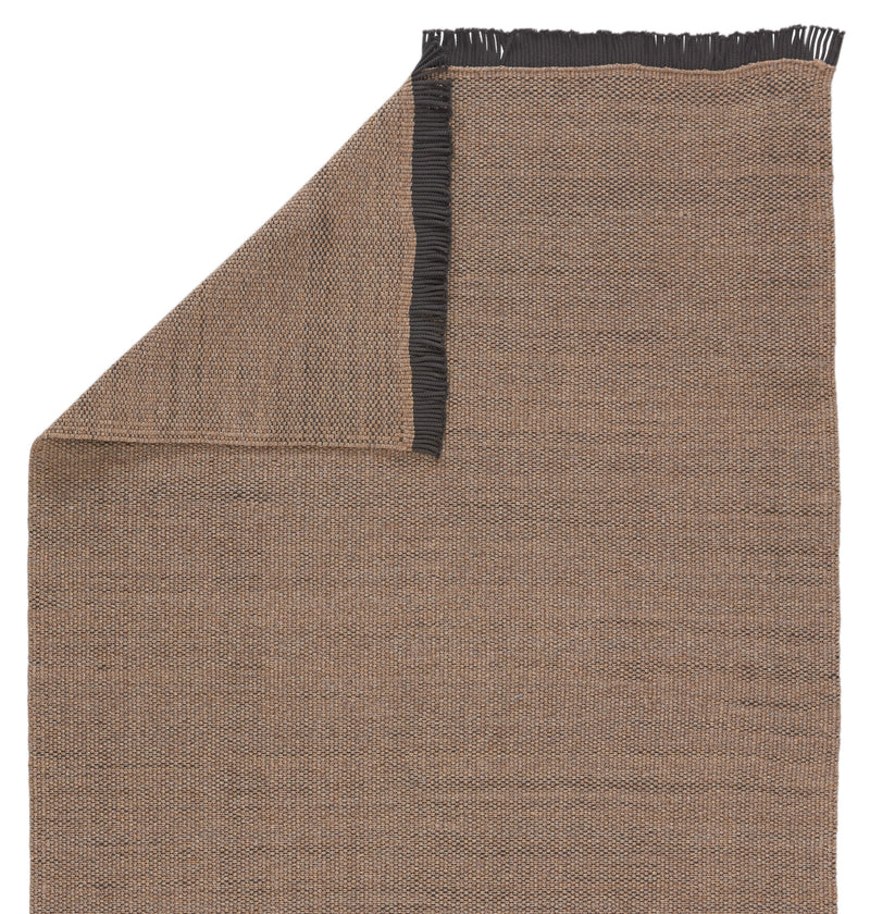 media image for savvy handmade indoor outdoor solid tan black area rug by jaipur living 3 288