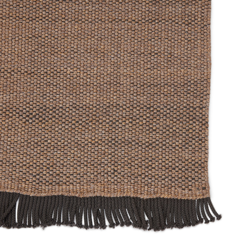 media image for savvy handmade indoor outdoor solid tan black area rug by jaipur living 4 287