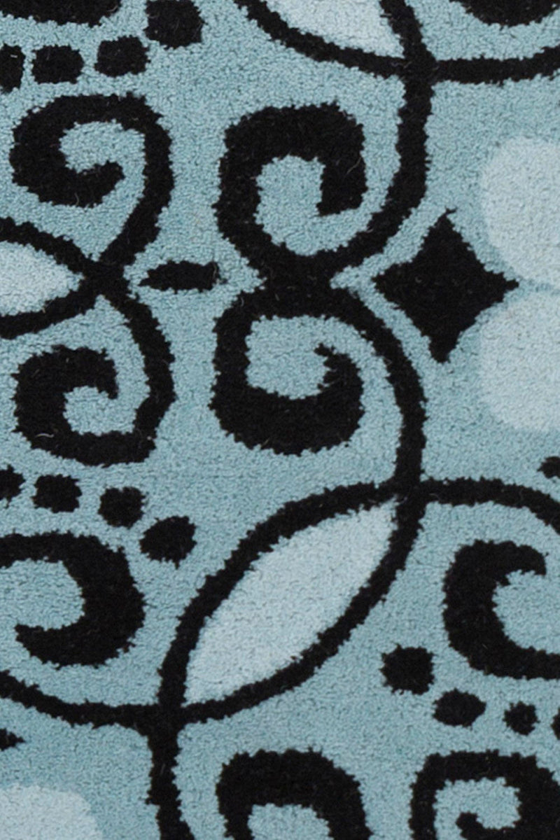 media image for stella blue black hand tufted wool rug by chandra rugs ste52211 576 2 270