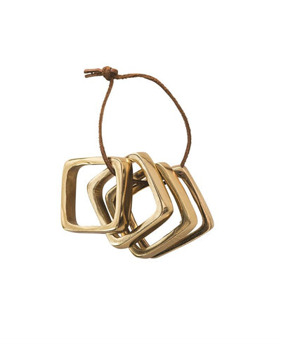 product image of square metal napkin rings on leather tie in brass finish design by bd edition 1 526