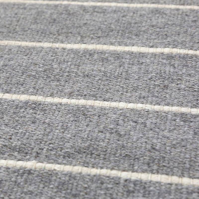 media image for warby handwoven rug in light grey in multiple sizes design by pom pom at home 9 237